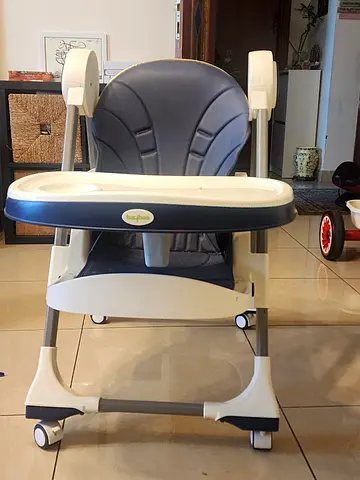 Used adjustable baby high chair with tray - good condition