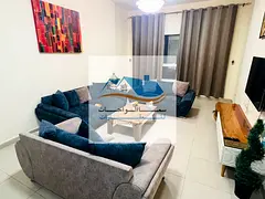 Sharjah, Al Khan, Ralrose Tower: One-bedroom apartment with a living room, two bathrooms, and a kitc