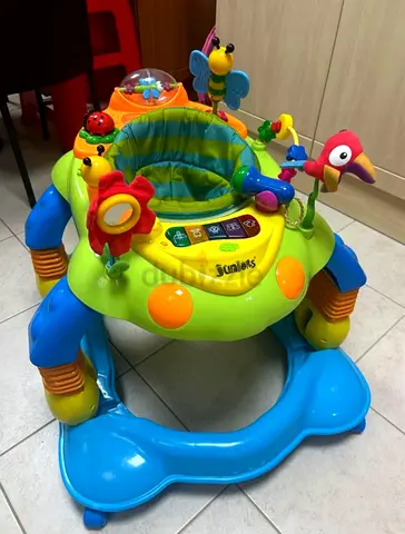 Baby activity walker/exersaucer with toys - good condition