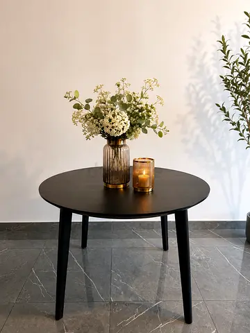 Round dining table in black wood