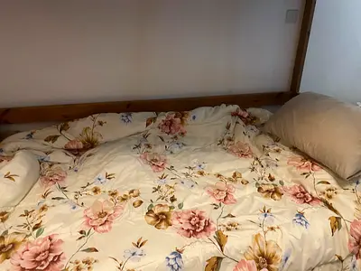 Wooden Single Bed Frame with Floral Bedding (Used)