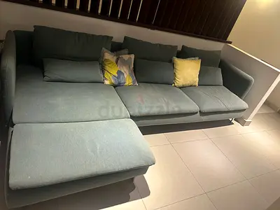 Light teal L-shaped 3-seater sofa with chaise, good condition