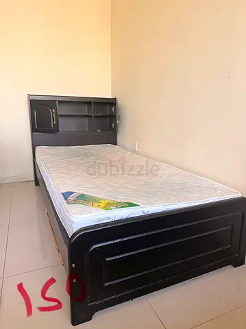 Single bed frame with mattress and headboard storage