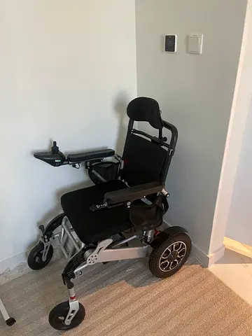 Compact electric wheelchair - lightweight foldable power chair (good condition)
