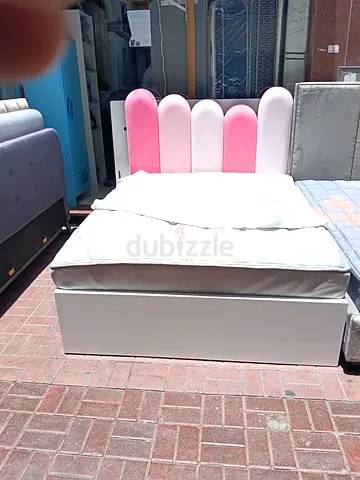Single bed with storage and pink scalloped headboard - good condition