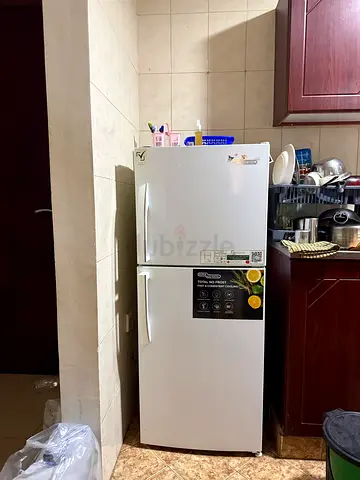 White double-door refrigerator - good working condition