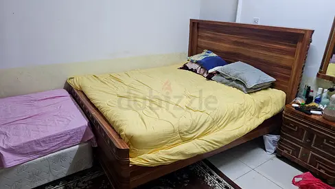 Queen wooden bed frame with headboard and matching bedside cabinet - used