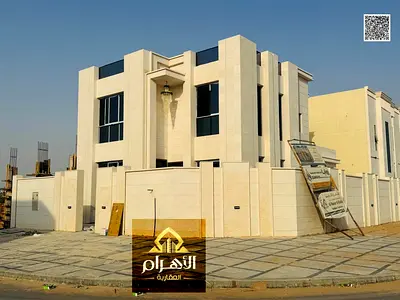For Sale: Corner Villa on two streets in Al Helio 2 area, Ajman. Prime location directly opposite Azhi Mall. Price includes registration and ownership