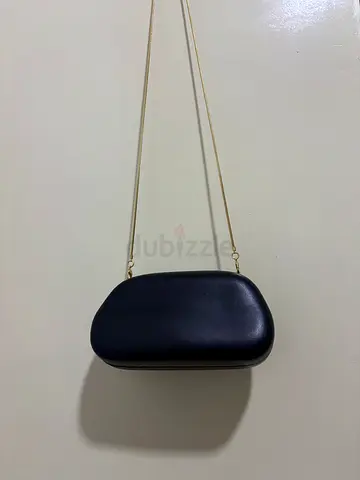 Elegant Black Hard Shell Clutch with Gold Chain Strap