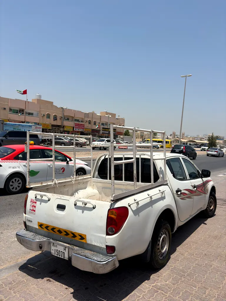 Mitsubishi L200 2013 — photo 1 of 5