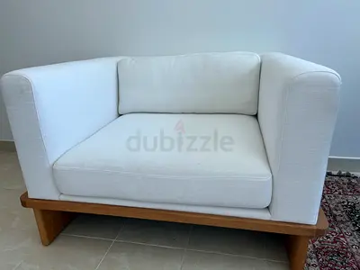Authentic CB2 Ivory Lounge Chair with Solid Wood Base