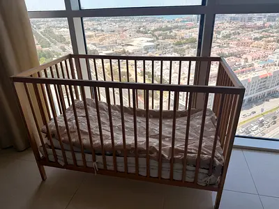 Wooden Baby Crib / Cot in good condition — single mattress included