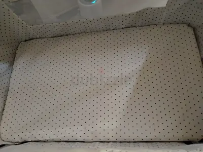 Lightweight portable baby bassinet mattress (polka dot cover) - used