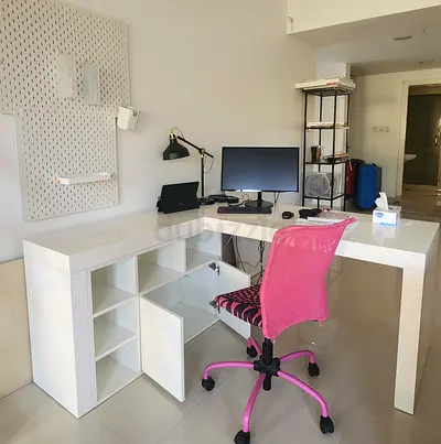 Office with wall organiser and chair