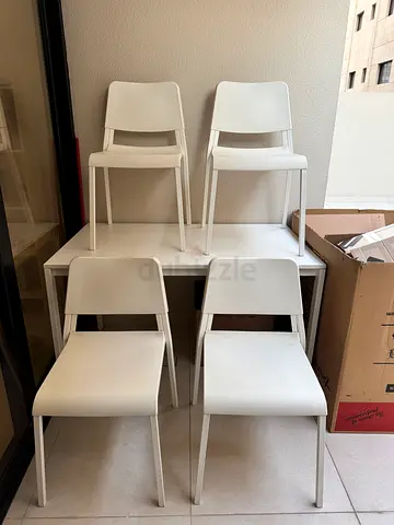 IKEA Set of 4 white modern dining chairs and table - good condition
