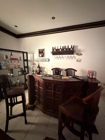 Solid Wood Home Bar Counter with 4 matching stools and drinks light up shelves