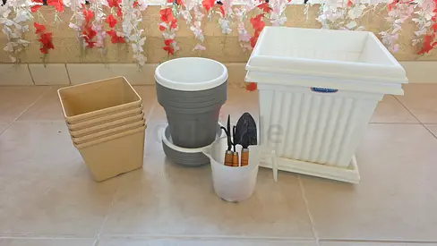 Mixed plastic planters and small gardening tools - set of 12 pots and accessories
