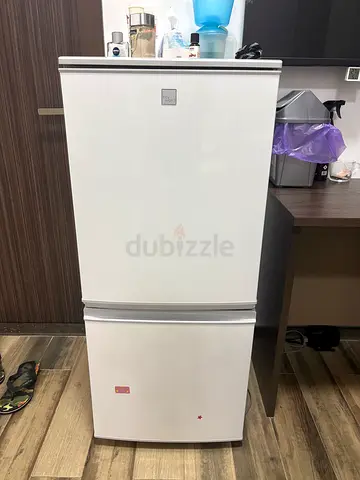 White two-door refrigerator/freezer - good working condition