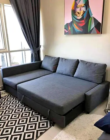 Grey L-shaped sofa bed with storage - good condition