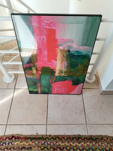 Framed abstract painting with pink and green tones