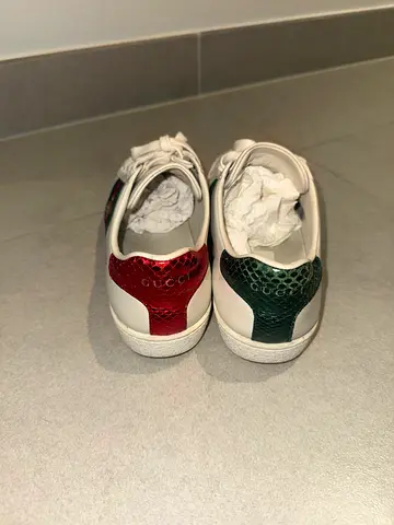 White leather sneakers with green  red heel accents, size 37