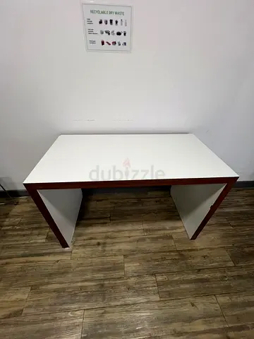 Simple white desk with wood trim — compact study table