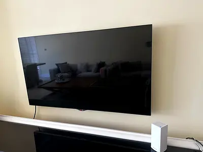 LG 55 OLED TV (wall-mounted) with Soundbar - Excellent Condition