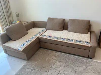L-shaped beige fabric sofa with storage - good condition