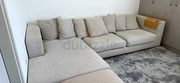 Light grey L-shaped fabric sofa with chaise - good condition