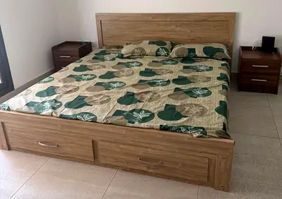 Queen bed frame with storage and two bedside tables - good condition