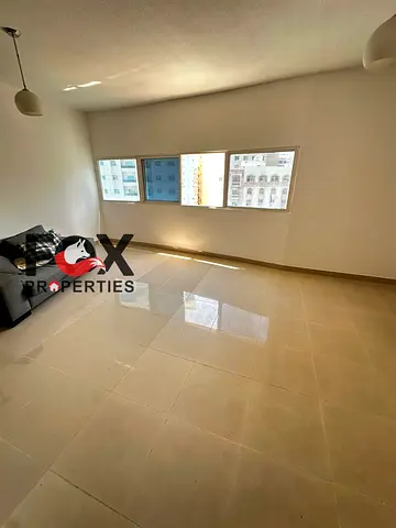 Two bedrooms and a living room for annual rent in Al Nuaimiya3 area,with a balcony,central air cond