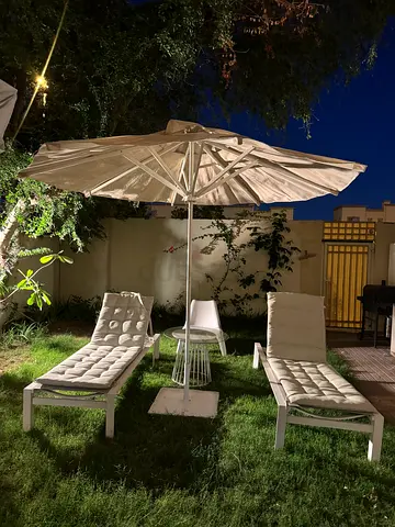 Outdoor garden loungers set with parasol and side table