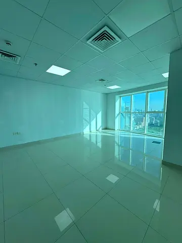 Office for annual rent in Sharjah | Al Majaz 2 | Free A/C | Direct lake view | 1 month free | Amazing price | Spacious area