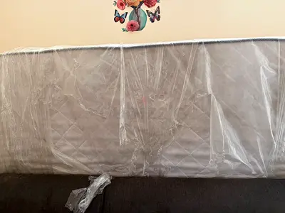 Queen Size Mattress - New, still packed (firm), original packing is slightly torn.