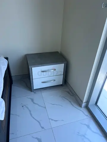 Small wall-mounted bedside cabinet with two doors