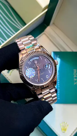 Rolex Day-Date style rose gold wristwatch with Arabic numerals