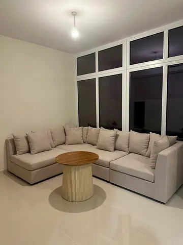 L-shaped sectional sofa with cushions - good condition