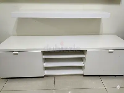 White cabinet with storage shelves and doors