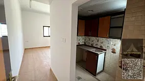 Large studio apartment in a prime location in Al Muwaihat 3, in a new building with central air con