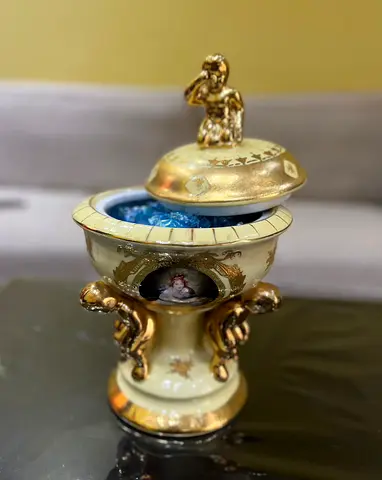 Porcelain Covered Urn with Gilt Cherub Handles and Classical Portrait