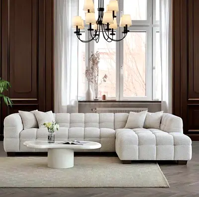 Light grey tufted L-shaped sectional sofa — modern, comfortable