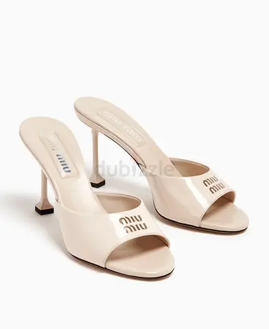 Cream Miu Miu Patent Leather Open-Toe Mule Heels - 38,5 size. Original price: 4400 AED