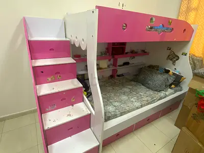 Pink and white loft bunk bed with built-in drawers and shelves - used