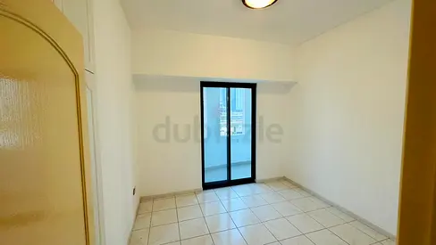 A private bedroom with balcony and washroom available in a well-maintained apartment.