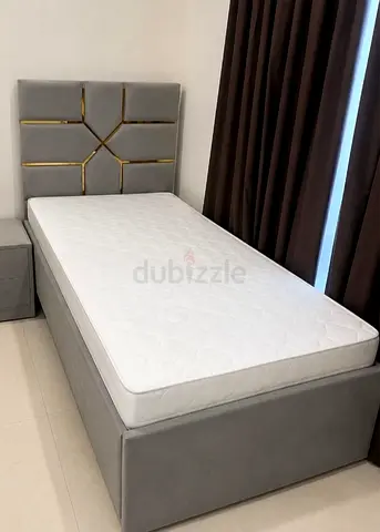 Single upholstered bed frame with headboard and mattress - grey