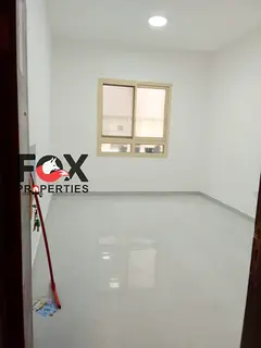For annual rent, 1-bedroom apartment in Rashidiya 3, spacious layout, central AC, near Lulu Market a