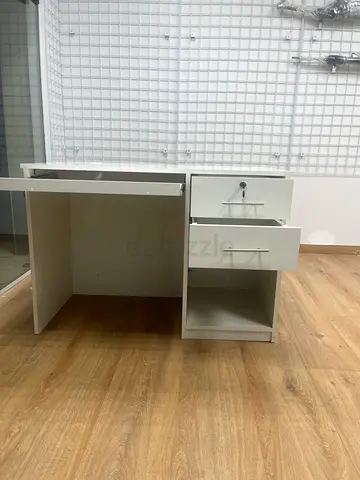White and dark-wood office desk with cable hole, good condition