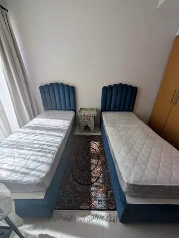 Beautiful blue velvet single size beds with mattress included
