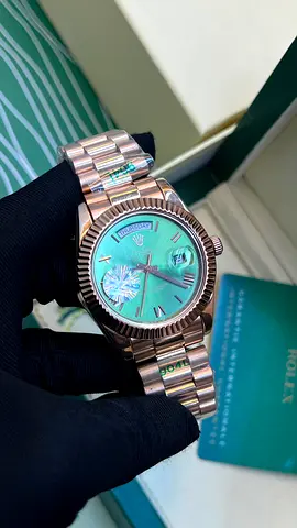 Rolex Day-Date style rose gold watch with green mother-of-pearl dial