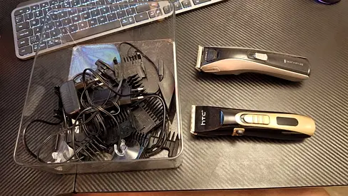 Used electric hair trimmers with multiple guards and chargers - good condition